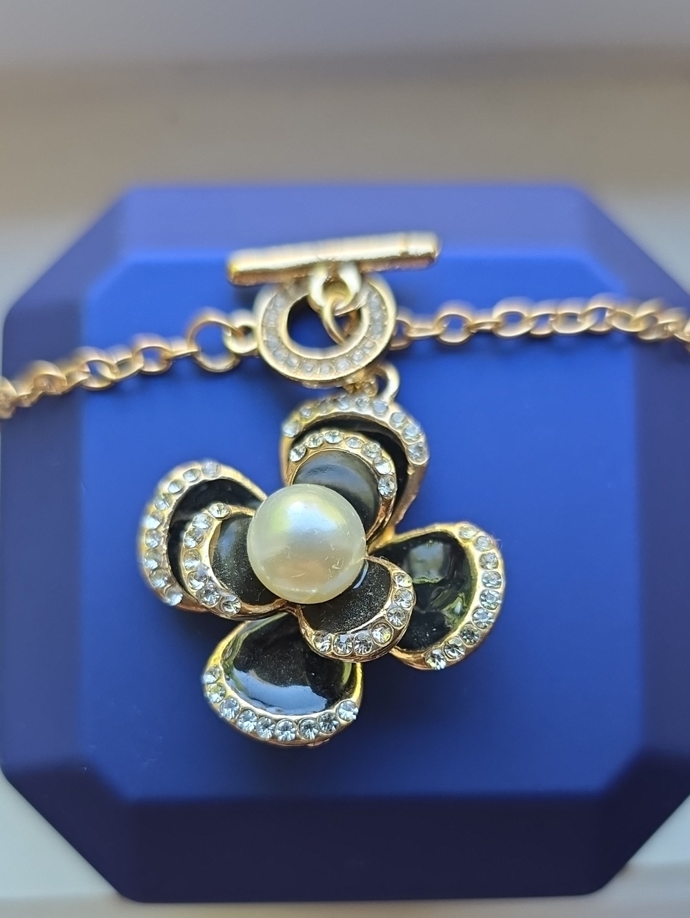 Gold-Tone Black Enamel Flower Pendant Necklace with Pearl Accent